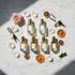 Michael Malul Women's Discovery Travel Size Set - 6 perfume bottles on marble with florals